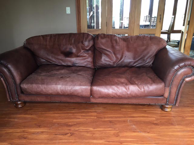 faded leather on couch