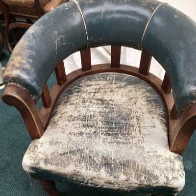 leather captains chair needing restoration work