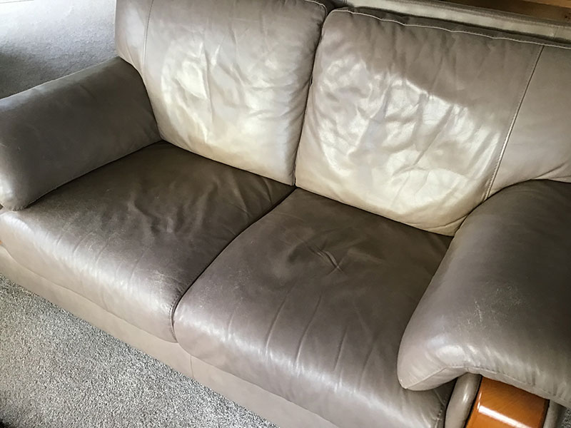worn out leather couch