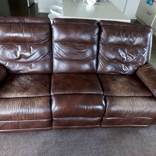 Worn leather couch