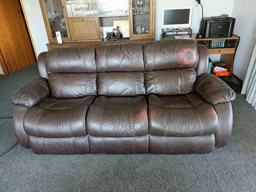 worn leather 3 seater couch