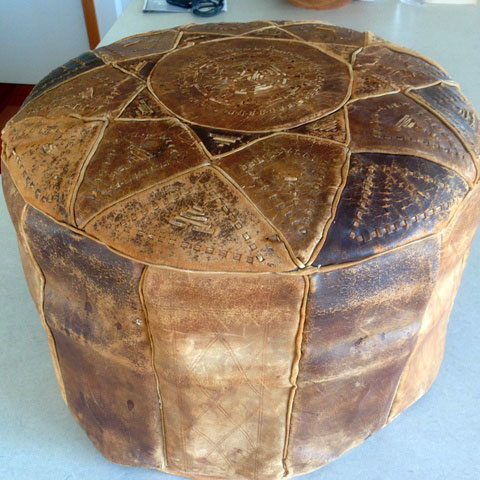 old leather ottoman