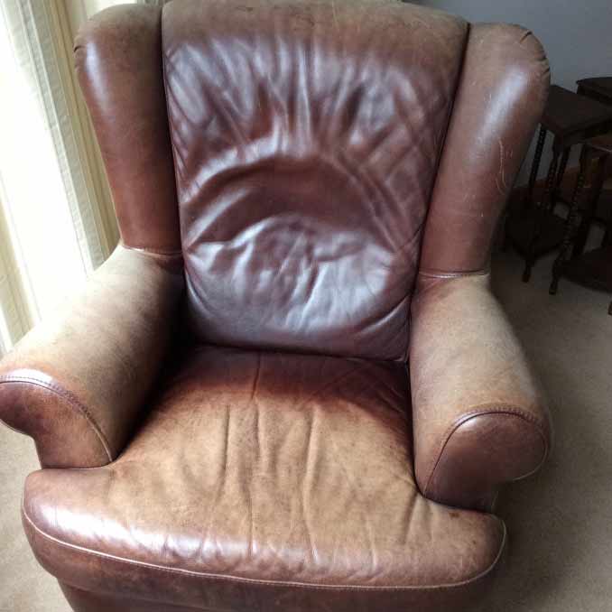 Faded waxed oiled leather chair