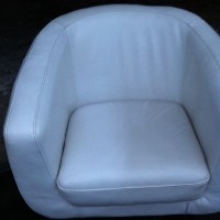 half cleaned leather tub chair