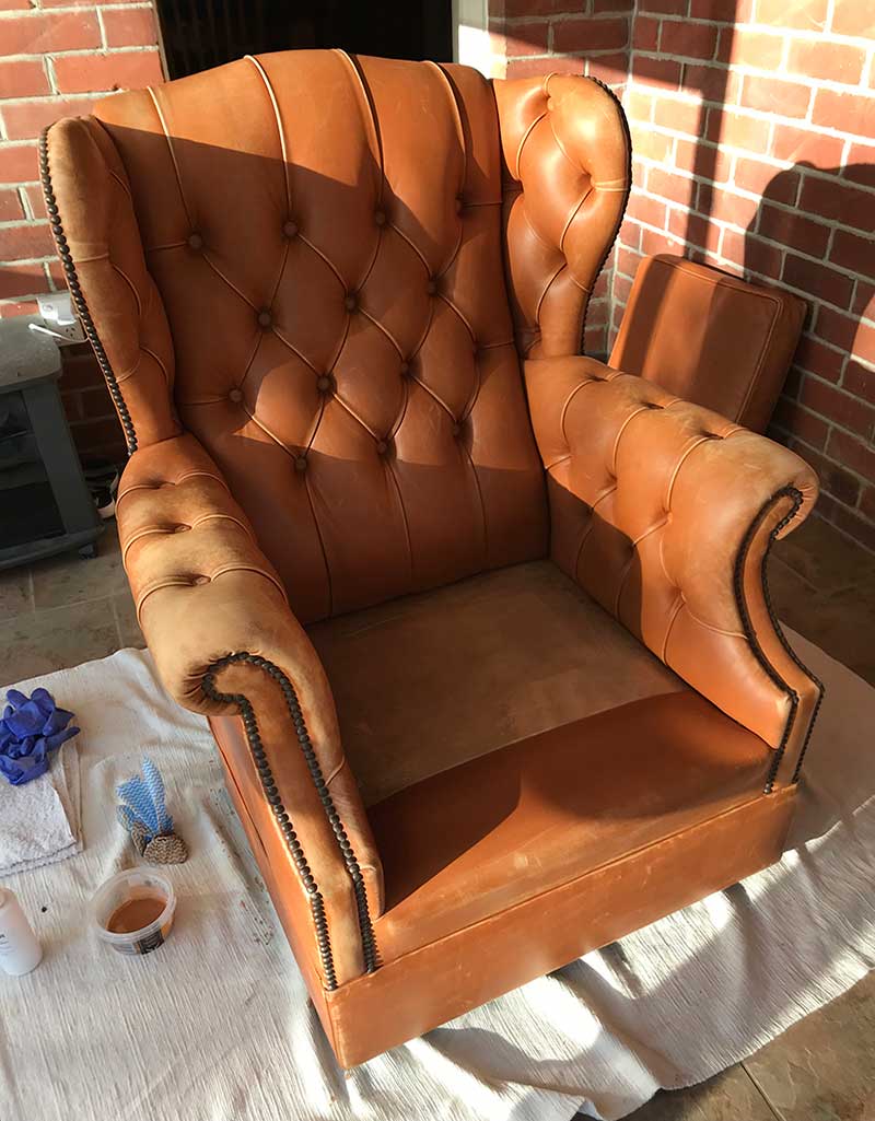 old wing-back leather chair