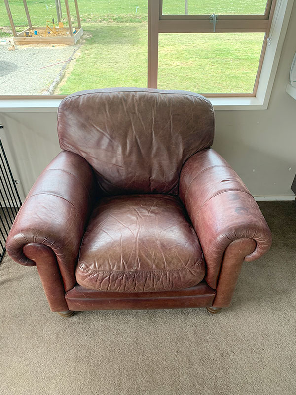 tired waxed oiled leather chair