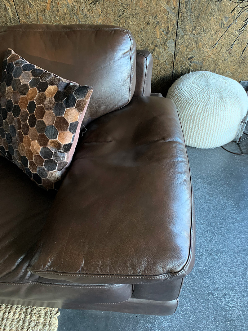 worn leather couch restored