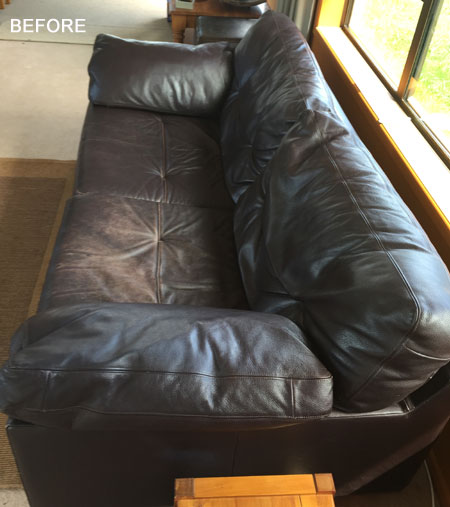 worn out brown leather couch