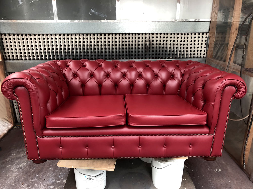 Red leather couch after restoration