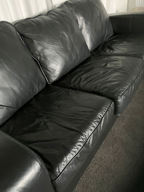 worn leather couch restored