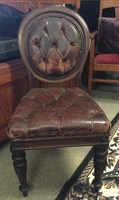 Close-up of cracked leather chair